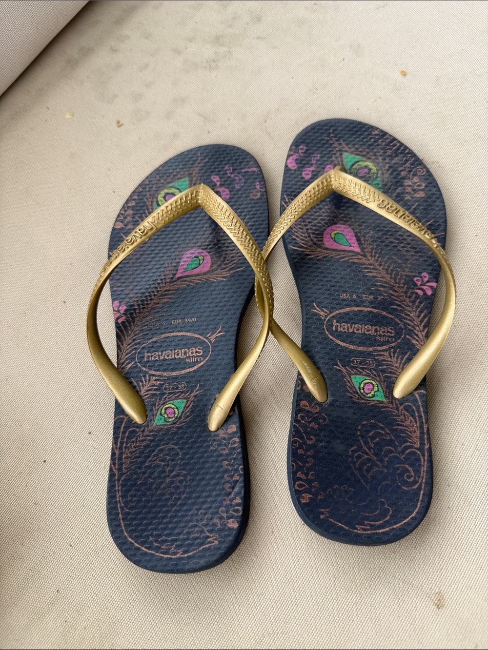 Havaianas Slim Navy Flip Flops with Gold Straps and Peacock Print